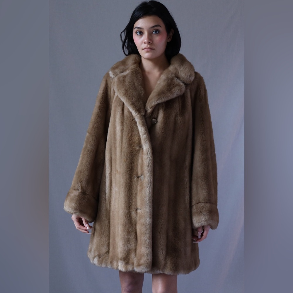Astral a coat fluffy. Brownish size 8 I believe normal wear not new for women